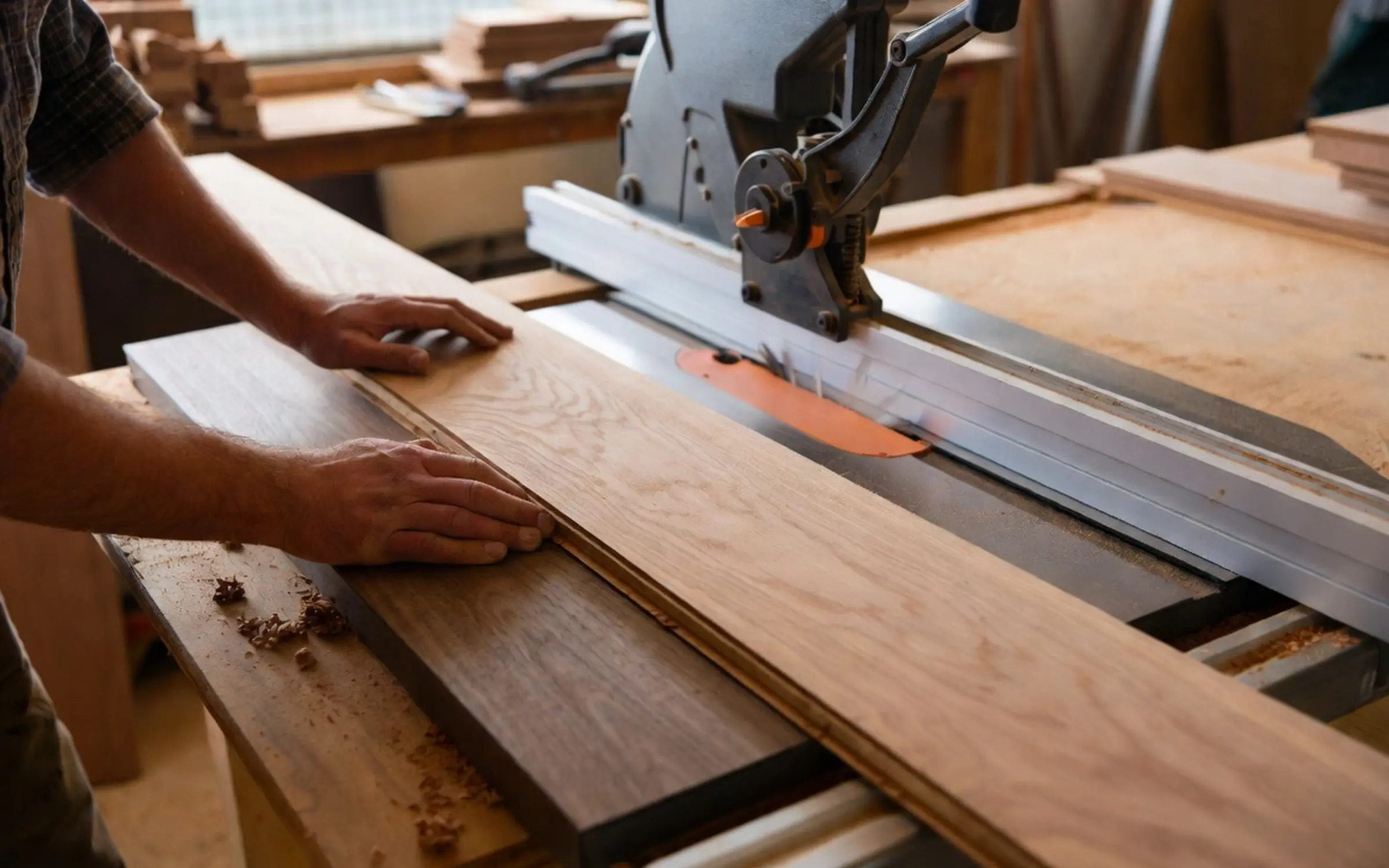 Table saw set up on a hardwood flooring job site for ripping boards